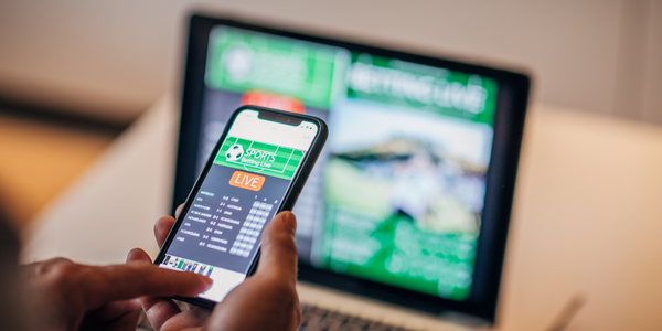 online gambling on a phone and laptop
