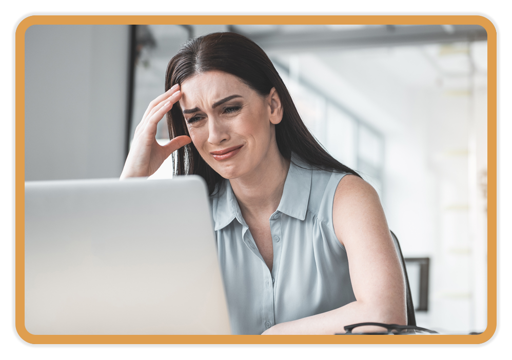 sad corporate woman at a laptop