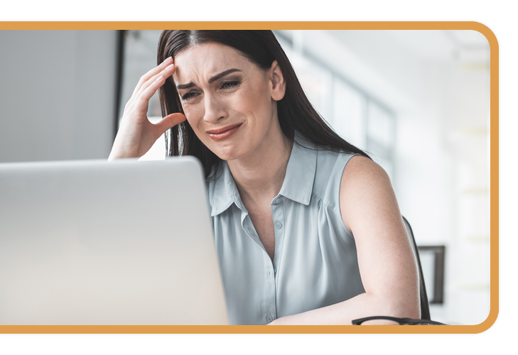 sad corporate woman at a laptop